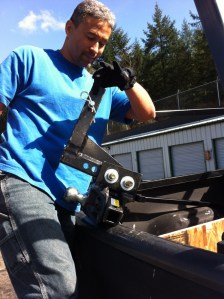 Mike hauls out the very weighty hitch-it takes 2 of us to attach (